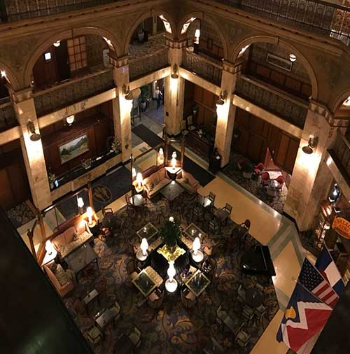 Hotel lobby under discreet furniture refurbishment.